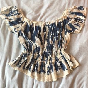 Off the shoulder tie dye shirt.